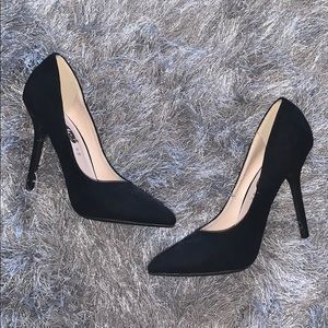 Solid black suede pumps